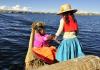 Woman and Child on Traditional Boat on Body of Water in South America 