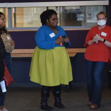 Faculty sharing a laugh at the Fall Reception