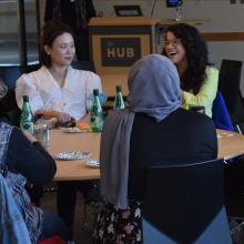 A table of people talking and sharing a laugh. 